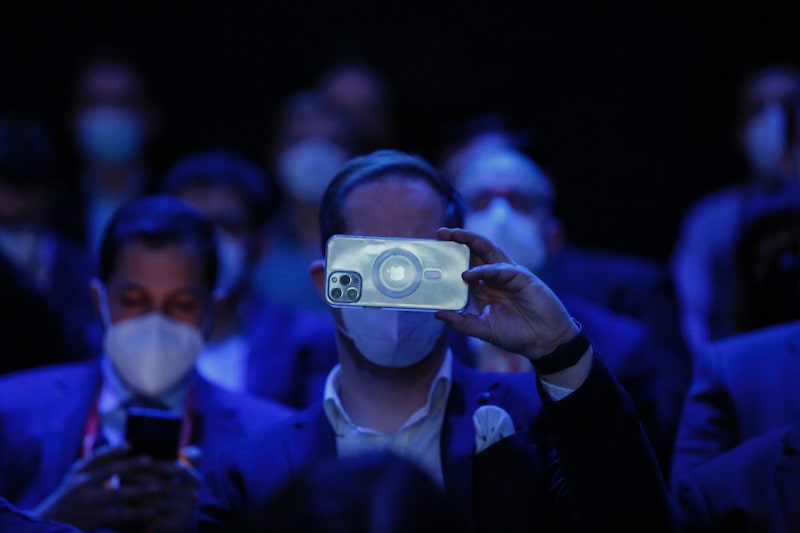 An attendee uses an Apple inc. iPhone during a keynote session on the opening day of the MWC Barcelona at the Fira de Barcelona venue in Barcelona, Spain, on Monday, Feb. 28, 2022. Over 1,800 exhibitors and attendees from 183 countries will attend the annual event, which runs from Feb. 28 to March 3. Photographer: Angel Garcia/Bloomberg An attendee uses an Apple inc. iPhone during a keynote session on the opening day of the MWC Barcelona at the Fira de Barcelona venue in Barcelona, Spain, on Monday, Feb. 28, 2022. Over 1,800 exhibitors and attendees from 183 countries will attend the annual event, which runs from Feb. 28 to March 3. Photographer: Angel Garcia/Bloomberg
