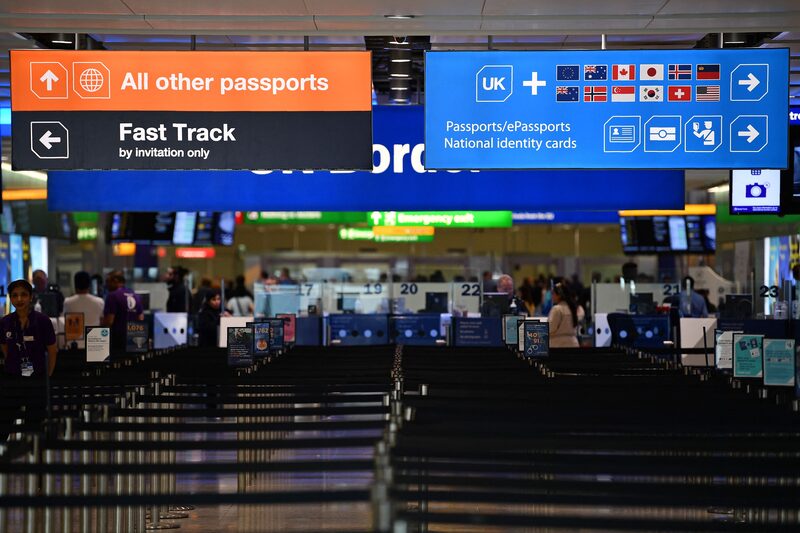 Passport signs directing passengers, are pictured at the passport control in Arrivals in Terminal 2 at Heathrow Airport in London on July 16, 2019 (Photo by Daniel LEAL / AFP) (Photo by DANIEL LEAL/AFP via Getty Images) Passport signs directing passengers, are pictured at the passport control in Arrivals in Terminal 2 at Heathrow Airport in London on July 16, 2019 (Photo by Daniel LEAL / AFP) (Photo by DANIEL LEAL/AFP via Getty Images)