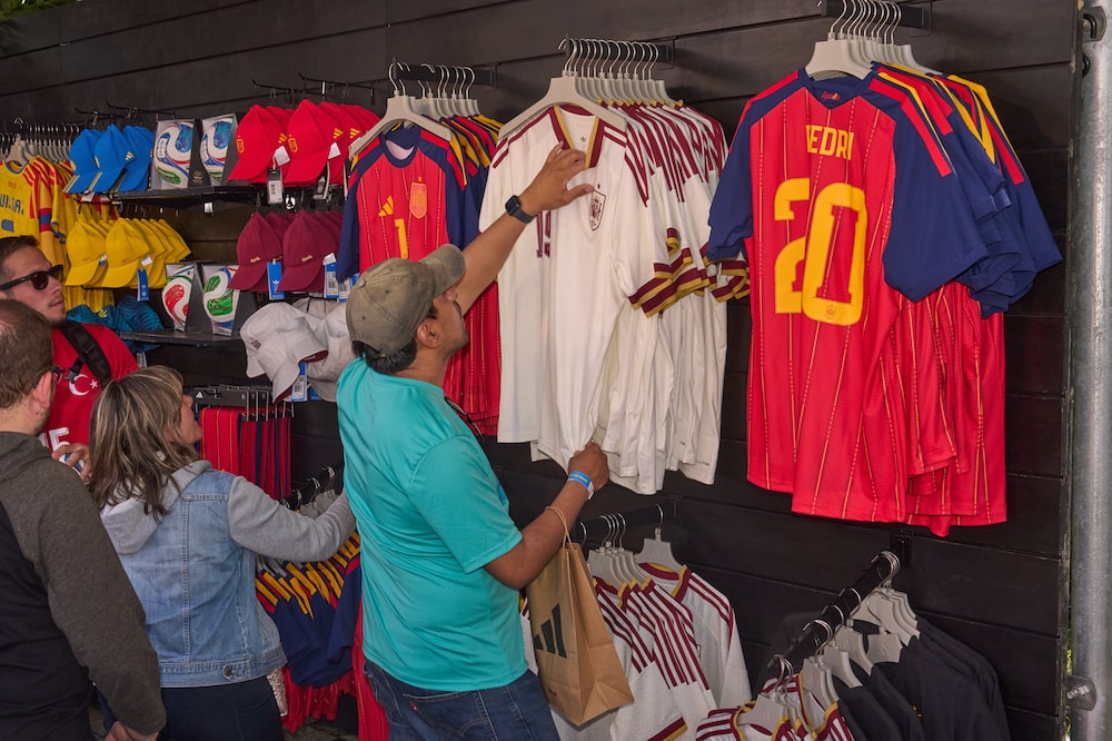 Spain team jerseys for sale at a FIFA World Cup 2026 watch party hosted by Adidas at Brooklyn Bridge Park in the Brooklyn borough of New York, US, on Tuesday, June 16, 2026. The World Cup is back in the US for the first time since 1994 in its biggest version yet, encompassing 48 teams and 104 matches that are also being played in neighboring Canada and Mexico. Photographer: Bing Guan/Bloomberg Spain team jerseys for sale at a FIFA World Cup 2026 watch party hosted by Adidas at Brooklyn Bridge Park in the Brooklyn borough of New York, US, on Tuesday, June 16, 2026. The World Cup is back in the US for the first time since 1994 in its biggest version yet, encompassing 48 teams and 104 matches that are also being played in neighboring Canada and Mexico. Photographer: Bing Guan/Bloomberg