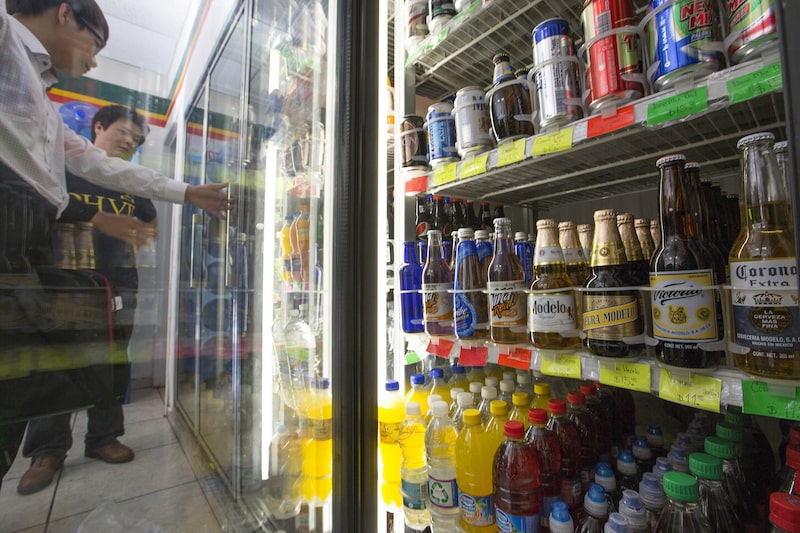 Bottles of Grupo Model SAB's Modelo, Negra Modelo and Corona beer sit inside a cooler in a store in Mexico City, Mexico, on Thursday, June 6, 2013. Heineken NV and Grupo Modelo SAB, the dominant brewers in Mexico with brands such as Dos Equis and Corona, are nearing the end of an almost three-year-old government antitrust probe. Photographer: Susana Gonzalez/Bloomberg Bottles of Grupo Model SAB's Modelo, Negra Modelo and Corona beer sit inside a cooler in a store in Mexico City, Mexico, on Thursday, June 6, 2013. Heineken NV and Grupo Modelo SAB, the dominant brewers in Mexico with brands such as Dos Equis and Corona, are nearing the end of an almost three-year-old government antitrust probe. Photographer: Susana Gonzalez/Bloomberg