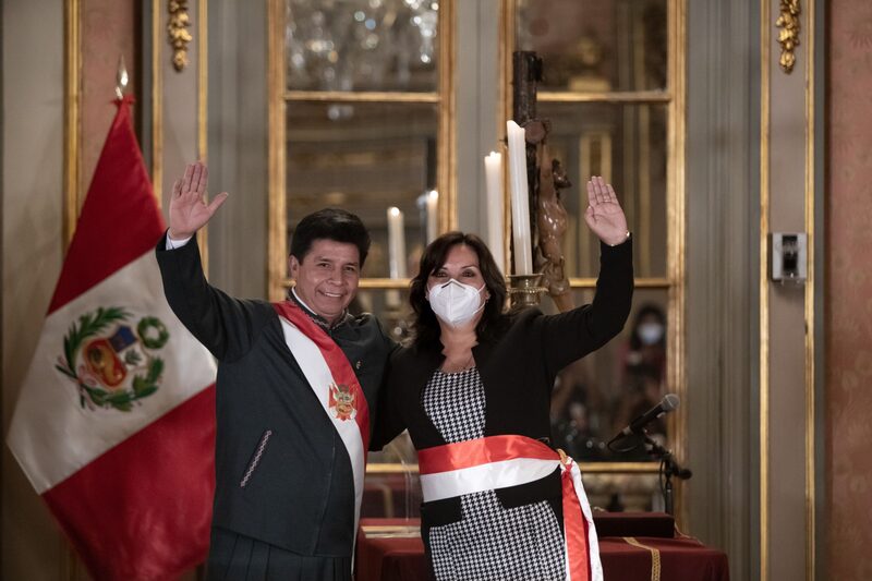 Pedro Castillo, Peru's president, left, and Dina Boluarte, Peru's new minister of development and social inclusion, wave during a swearing-in ceremony at the Government Palace in Lima, Peru, on Tuesday, Feb. 8, 2022. Castillo has repeatedly made changes to his cabinet since taking office, including naming his fourth prime minister in just over six months as he tries to restore stability after weeks of political turmoil. Photographer: Angela Ponce/Bloomberg Pedro Castillo, Peru's president, left, and Dina Boluarte, Peru's new minister of development and social inclusion, wave during a swearing-in ceremony at the Government Palace in Lima, Peru, on Tuesday, Feb. 8, 2022. Castillo has repeatedly made changes to his cabinet since taking office, including naming his fourth prime minister in just over six months as he tries to restore stability after weeks of political turmoil. Photographer: Angela Ponce/Bloomberg