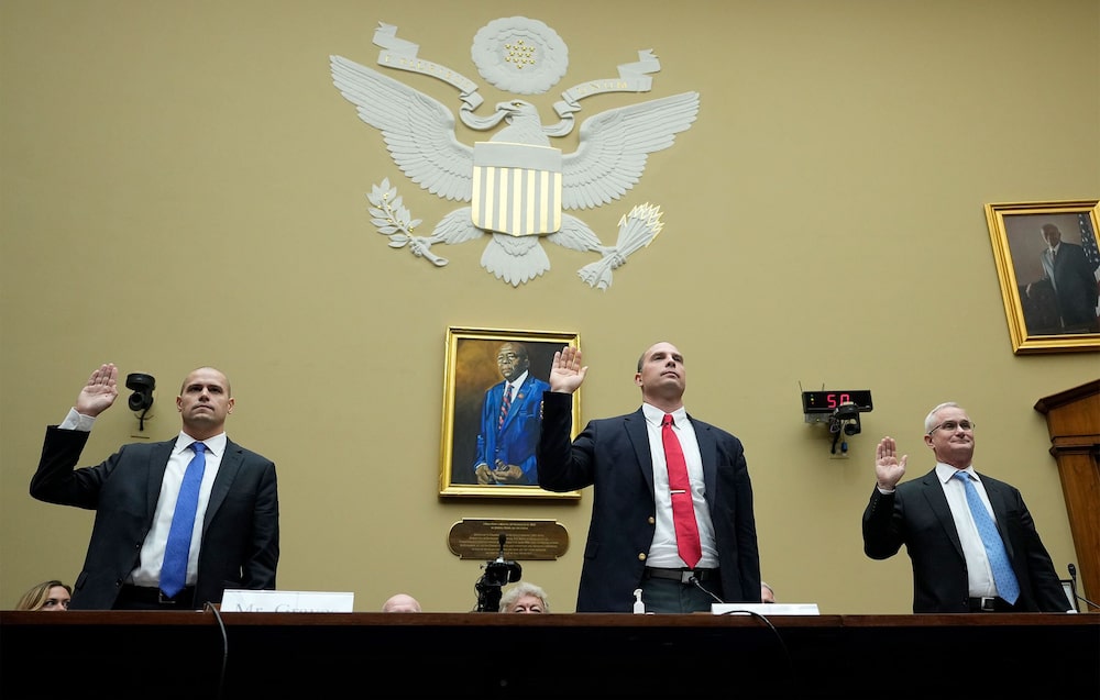Ryan Graves, from left, David Grusch and David Fravor are sworn-in during a House hearing in Washington, DC, on Wednesday. Ryan Graves, from left, David Grusch and David Fravor are sworn-in during a House hearing in Washington, DC, on Wednesday.