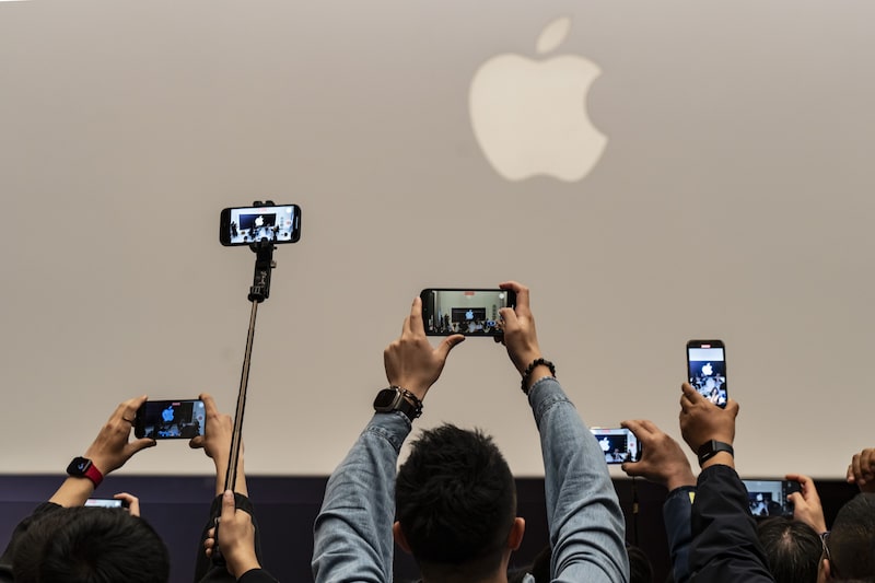 Customers take photographs during the opening of the new Apple Inc. Jingan store in Shanghai, China, on Thursday, March 21, 2024. Apple Inc. opened its eighth store in Shanghai, adding to its largest retail network after the US at a time iPhone sales in China are slowing. Photographer: Qilai Shen/Bloomberg Customers take photographs during the opening of the new Apple Inc. Jingan store in Shanghai, China, on Thursday, March 21, 2024. Apple Inc. opened its eighth store in Shanghai, adding to its largest retail network after the US at a time iPhone sales in China are slowing. Photographer: Qilai Shen/Bloomberg