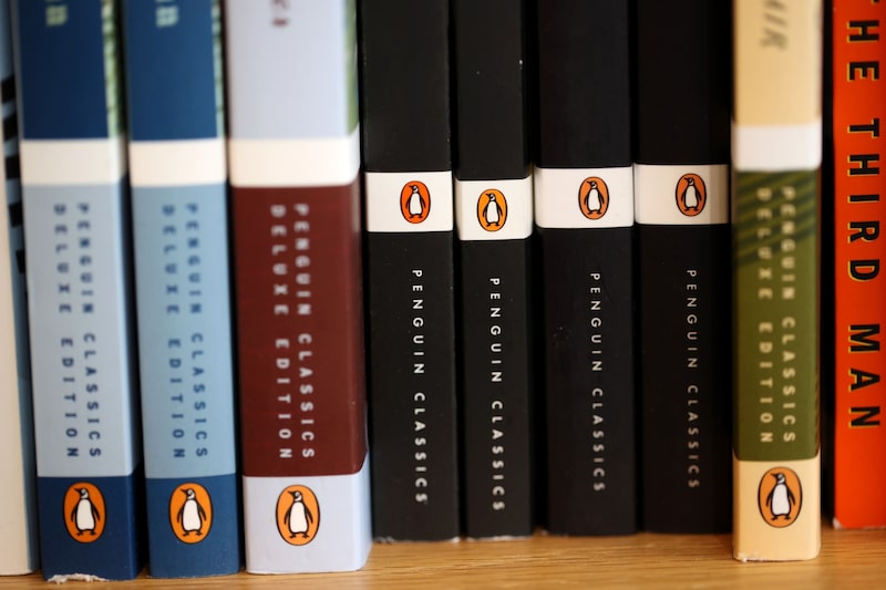 The Penguin logo is visible on the spines of books displayed on a shelf at Book Passage on November 02, 2021 in Corte Madera, California. The Penguin logo is visible on the spines of books displayed on a shelf at Book Passage on November 02, 2021 in Corte Madera, California.