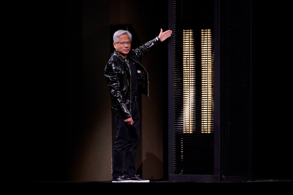 Jensen Huang, chief executive officer of Nvidia Corp., presents the Nvidia Rubin platform during the Nvidia Live event at CES 2026 in Las Vegas, Nevada, US, on Monday, Jan. 5, 2026. Nvidia Corp.'s highly anticipated new Rubin data center products are nearing release this year and customers will soon be able to try out the technology, helping speed AI development. Photographer: Bridget Bennett/Bloomberg Jensen Huang, chief executive officer of Nvidia Corp., presents the Nvidia Rubin platform during the Nvidia Live event at CES 2026 in Las Vegas, Nevada, US, on Monday, Jan. 5, 2026. Nvidia Corp.'s highly anticipated new Rubin data center products are nearing release this year and customers will soon be able to try out the technology, helping speed AI development. Photographer: Bridget Bennett/Bloomberg