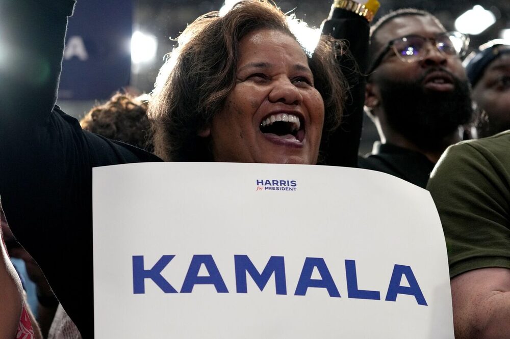 An attendee holds a sign supporting the vice president at a July 23 event in Milwaukee.Photographer: Daniel Steinle/Bloomberg An attendee holds a sign supporting the vice president at a July 23 event in Milwaukee.Photographer: Daniel Steinle/Bloomberg