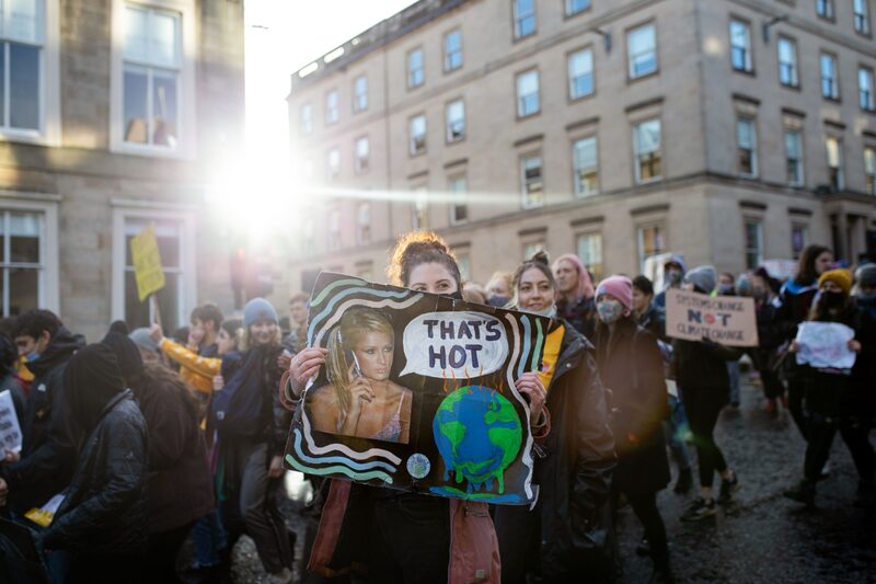 A climate activists holds a sign during a "Global Day of Action" protest on the sidelines of the COP26 climate talks in Glasgow, U.K., on Saturday, Nov. 6, 2021. A climate activists holds a sign during a "Global Day of Action" protest on the sidelines of the COP26 climate talks in Glasgow, U.K., on Saturday, Nov. 6, 2021.