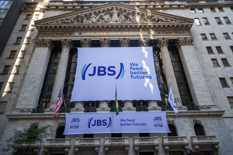 JBS NV signage at the New York Stock Exchange (NYSE) in New York, US, on Wednesday, June 25, 2025. JBS NV shares started trading in New York on June 13, giving the world's largest meat producer a market value of about $15 billion as it culminated a years-long effort to reach a broader pool of investors. Photographer: Michael Nagle/Bloomberg JBS NV signage at the New York Stock Exchange (NYSE) in New York, US, on Wednesday, June 25, 2025. JBS NV shares started trading in New York on June 13, giving the world's largest meat producer a market value of about $15 billion as it culminated a years-long effort to reach a broader pool of investors. Photographer: Michael Nagle/Bloomberg