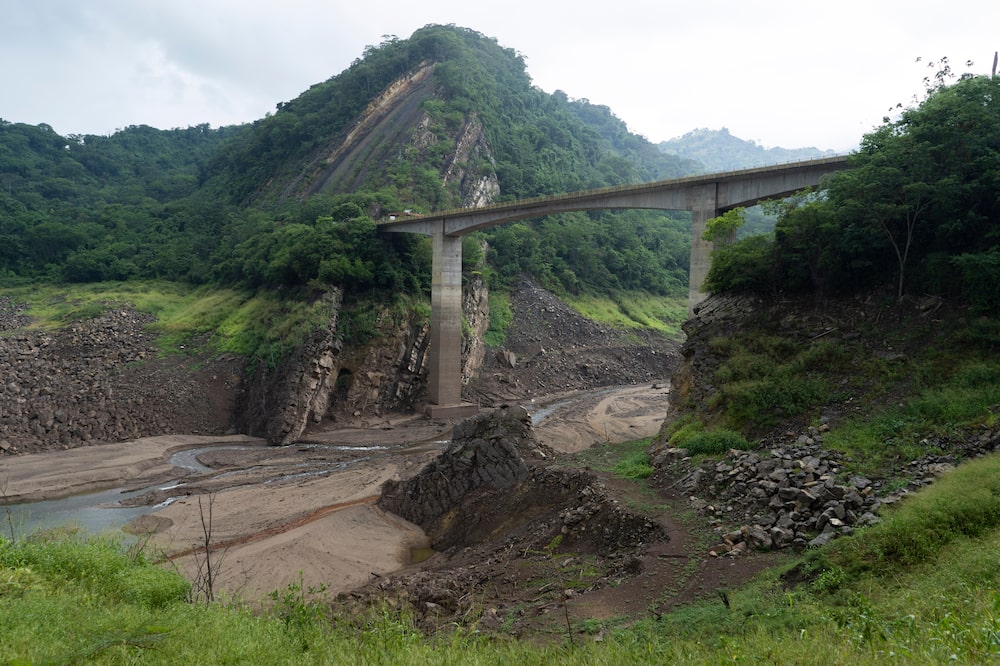 Low water levels at the Sogamoso hydroelectric dam near Bucaramanga, Santander department, Colombia, on Sunday, April 21, 2024. The average reservoir levels across Colombia have fallen below 29% of total capacity, just above the critical level of 27% which could trigger power outages. Photographer: Natalia Ortiz Mantilla/Bloomberg Low water levels at the Sogamoso hydroelectric dam near Bucaramanga, Santander department, Colombia, on Sunday, April 21, 2024. The average reservoir levels across Colombia have fallen below 29% of total capacity, just above the critical level of 27% which could trigger power outages. Photographer: Natalia Ortiz Mantilla/Bloomberg
