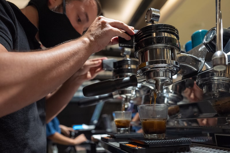 A barista wearing a protective mask uses a espresso machine at the Rituales Cafe in Medellin, Colombia, on Monday, Feb. 22, 2021. Colombia coffee outputs rose 3% year over year, with the country exporting more than 1,102,000 bags. Photographer: Juan Cristobal Cobo/Bloomberg A barista wearing a protective mask uses a espresso machine at the Rituales Cafe in Medellin, Colombia, on Monday, Feb. 22, 2021. Colombia coffee outputs rose 3% year over year, with the country exporting more than 1,102,000 bags. Photographer: Juan Cristobal Cobo/Bloomberg