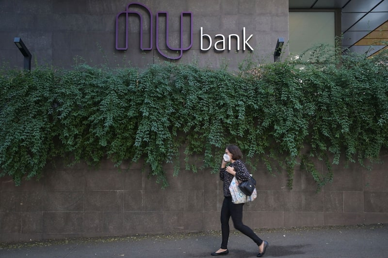 A woman walks past Brazilian fintech Nubank's headquarters, in Sao Paulo, Brazil. Photographer: Nelson Almeida/AFP/Getty Images A woman walks past Brazilian fintech Nubank's headquarters, in Sao Paulo, Brazil. Photographer: Nelson Almeida/AFP/Getty Images