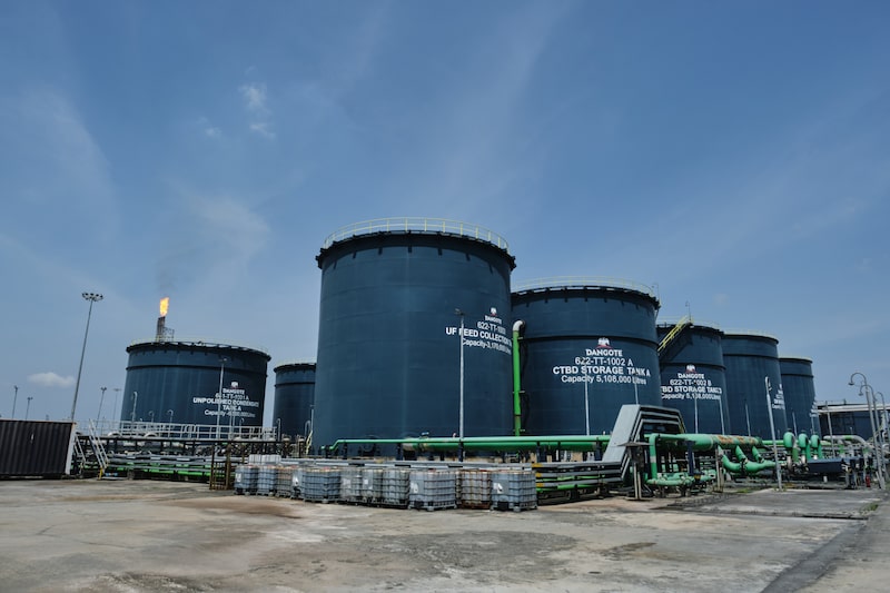 A flare stack and water collection tanks at the Dangote Petroleum Refinery and Petrochemicals FZE plant in Ibeju Lekki, Lagos, Nigeria, on Monday, Oct. 12, 2026. Dangote Petroleum Refinery and Petrochemicals FZE swung to a profit after Africas biggest oil-processing facility reached full capacity and as it undertakes the continents largest initial public offering to date. Photographer: Damilola Onafuwa/Bloomberg A flare stack and water collection tanks at the Dangote Petroleum Refinery and Petrochemicals FZE plant in Ibeju Lekki, Lagos, Nigeria, on Monday, Oct. 12, 2026. Dangote Petroleum Refinery and Petrochemicals FZE swung to a profit after Africas biggest oil-processing facility reached full capacity and as it undertakes the continents largest initial public offering to date. Photographer: Damilola Onafuwa/Bloomberg
