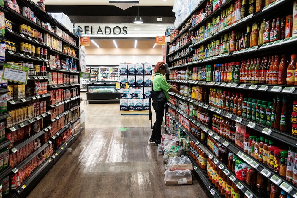 A worker wearing a protective mask and shield restocks shelves at a La Comer supermarket in Puerto Vallarta, Jalisco state, Mexico, on Tuesday, April 28, 2020. Mexico's economy suffered its deepest contraction in over a decade during the first quarter, and the recession is expected to intensify amid a shutdown to contain the coronavirus pandemic. Photographer: Cesar Rodriguez/Bloomberg A worker wearing a protective mask and shield restocks shelves at a La Comer supermarket in Puerto Vallarta, Jalisco state, Mexico, on Tuesday, April 28, 2020. Mexico's economy suffered its deepest contraction in over a decade during the first quarter, and the recession is expected to intensify amid a shutdown to contain the coronavirus pandemic. Photographer: Cesar Rodriguez/Bloomberg