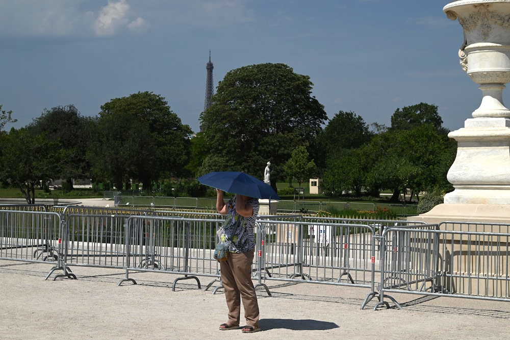 A visitor uses an umbrella for shade during high temperatures in central Paris, France, on Friday, June 26, 2026. The intense and unusually early heat underscores how climate change is transforming summers in the worlds fastest-warming continent. Photographer: Benjamin Girette/Bloomberg A visitor uses an umbrella for shade during high temperatures in central Paris, France, on Friday, June 26, 2026. The intense and unusually early heat underscores how climate change is transforming summers in the worlds fastest-warming continent. Photographer: Benjamin Girette/Bloomberg