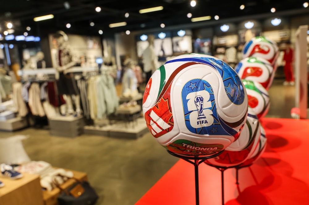 A display of Adidas AG World Cup 2026 footballs in their flagship store in Herzogenaurach, Germany, on Wednesday, March 4, 2026. Adidas forecast higher profits this year and market share gains through 2028 as the German brand looks to maintain its momentum with retro sneakers and new running and football products. Photographer: Alex Kraus/Bloomberg A display of Adidas AG World Cup 2026 footballs in their flagship store in Herzogenaurach, Germany, on Wednesday, March 4, 2026. Adidas forecast higher profits this year and market share gains through 2028 as the German brand looks to maintain its momentum with retro sneakers and new running and football products. Photographer: Alex Kraus/Bloomberg