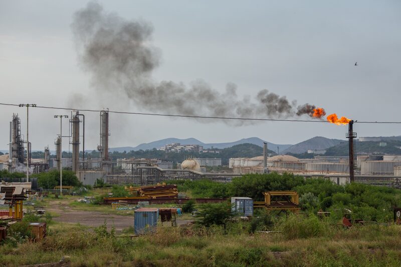 The Puerto La Cruz refinery in Puerto La Cruz, Venezuela, on Wednesday, Oct. 13, 2021. State-owned Petroleos de Venezuela SA has been pumping about 908,000 barrels a day in the past week, but to reach that milestone they have resorted to desperate measures such as handing out contracts to little-known local companies with the promise of payments in scrap metal or backpacks stuffed with U.S. dollars, according to people with direct knowledge of the matter. Photographer: Manaure Quintero/Bloomberg The Puerto La Cruz refinery in Puerto La Cruz, Venezuela, on Wednesday, Oct. 13, 2021. State-owned Petroleos de Venezuela SA has been pumping about 908,000 barrels a day in the past week, but to reach that milestone they have resorted to desperate measures such as handing out contracts to little-known local companies with the promise of payments in scrap metal or backpacks stuffed with U.S. dollars, according to people with direct knowledge of the matter. Photographer: Manaure Quintero/Bloomberg