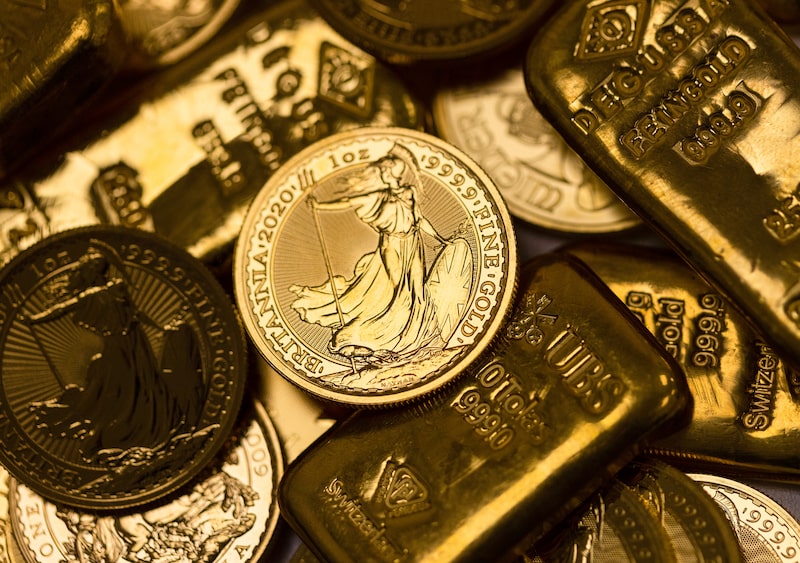 Gold bars and coins. Gold bars and coins.