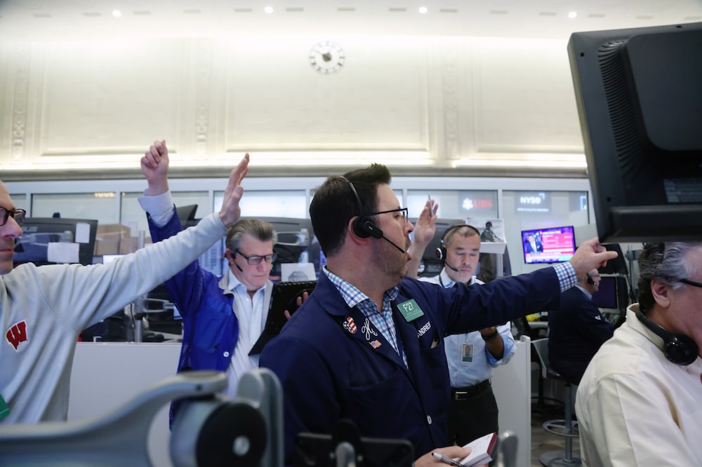 Traders At The New York Stock Exchange As Stocks And Bonds Slide Globally As Oil Tops $100 Traders At The New York Stock Exchange As Stocks And Bonds Slide Globally As Oil Tops $100