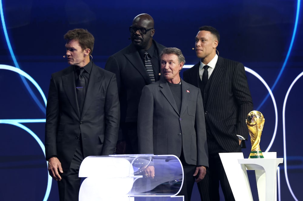WASHINGTON, DC - DECEMBER 05: Draw assistants Tom Brady, Wayne Gretzky, Shaquille O’Neal and Aaron Judge react with the FIFA World Cup Trophy during the FIFA World Cup 2026 Official Draw at John F. Kennedy Center for the Performing Arts on December 05, 2025 in Washington, DC. (Photo by Michael Regan - FIFA/FIFA via Getty Images) WASHINGTON, DC - DECEMBER 05: Draw assistants Tom Brady, Wayne Gretzky, Shaquille O’Neal and Aaron Judge react with the FIFA World Cup Trophy during the FIFA World Cup 2026 Official Draw at John F. Kennedy Center for the Performing Arts on December 05, 2025 in Washington, DC. (Photo by Michael Regan - FIFA/FIFA via Getty Images)