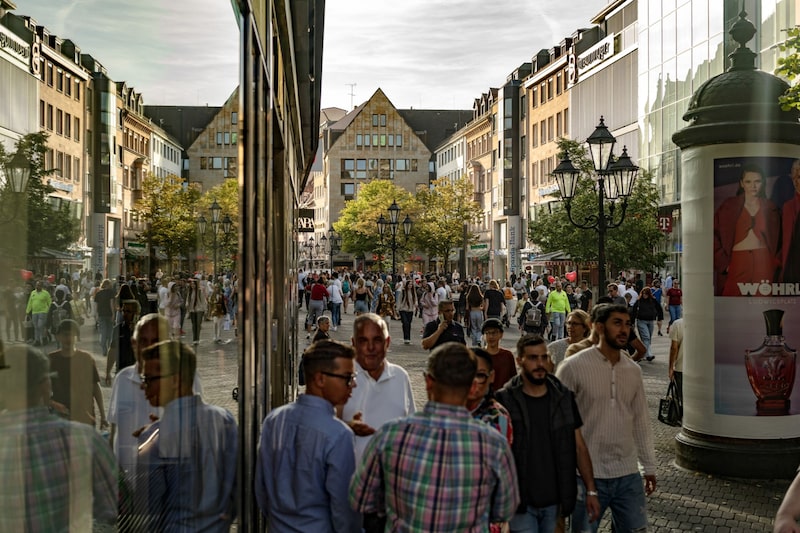 Shoppers walk along a pedestrianized shopping street in Nuremberg, Germany. Photographer: Ben Kilb/Bloomberg Shoppers walk along a pedestrianized shopping street in Nuremberg, Germany. Photographer: Ben Kilb/Bloomberg