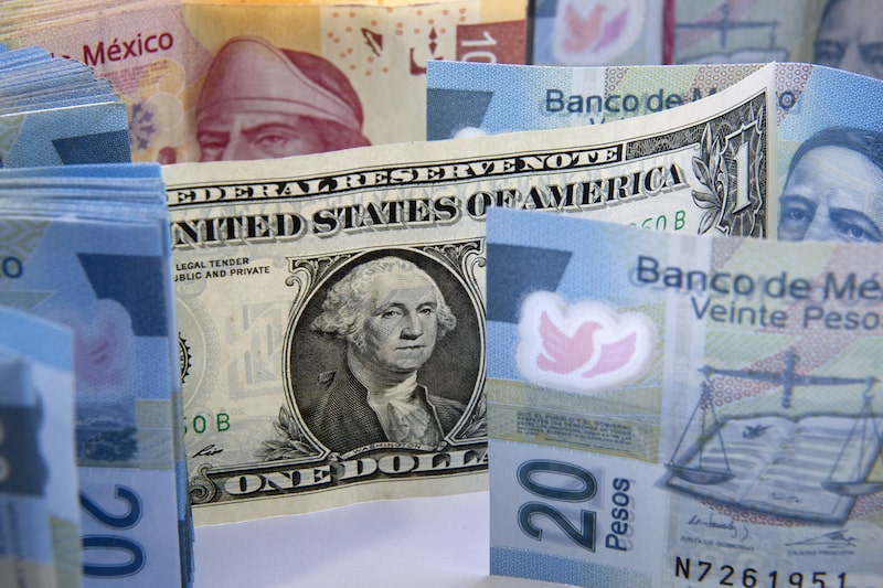 Mexican Peso bills are arranged for a photograph with a U.S. one dollar bill in Mexico City, Mexico, on Wednesday, Jan. 27, 2016. Mexicos peso, the worst performing major currency in 2016, is poised for a rebound by the end of this year, according to its most-accurate forecaster, Sireen Harajli, a strategist for Mizuho Bank Ltd. who was the best analyst for the peso in the fourth quarter, according to a Bloomberg ranking. Photographer: Susana Gonzalez/Bloomberg Mexican Peso bills are arranged for a photograph with a U.S. one dollar bill in Mexico City, Mexico, on Wednesday, Jan. 27, 2016. Mexicos peso, the worst performing major currency in 2016, is poised for a rebound by the end of this year, according to its most-accurate forecaster, Sireen Harajli, a strategist for Mizuho Bank Ltd. who was the best analyst for the peso in the fourth quarter, according to a Bloomberg ranking. Photographer: Susana Gonzalez/Bloomberg