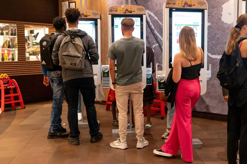 Customers place orders at self-service screens in a McDonald's Corp. fast food outlet in Strasbourg, France, on Wednesday, Sept. 14, 2022. French Finance Minister Bruno Le Maire raised this years economic-growth forecast to 2.7% from 2.5% as consumption and corporate investment hold up. Photographer: Benjamin Girette/Bloomberg Customers place orders at self-service screens in a McDonald's Corp. fast food outlet in Strasbourg, France, on Wednesday, Sept. 14, 2022. French Finance Minister Bruno Le Maire raised this years economic-growth forecast to 2.7% from 2.5% as consumption and corporate investment hold up. Photographer: Benjamin Girette/Bloomberg