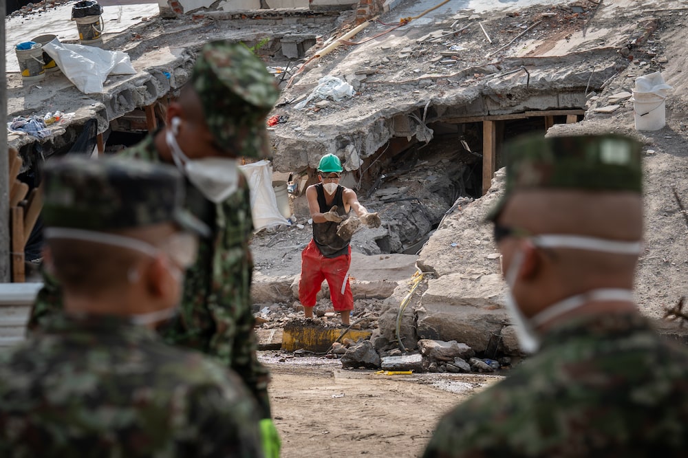 Volunteers remove rubble following the earthquake in Cali, Colombia, on Friday, Aug. 14, 2026. The 7.4-magnitude quake that struck on Monday was the second strongest recorded in Colombia in the past century. At least 281 people have died, with 3,971 injured and 379 missing, according to the national disaster management agency. Photographer: Nathalia Angarita/Bloomberg Volunteers remove rubble following the earthquake in Cali, Colombia, on Friday, Aug. 14, 2026. The 7.4-magnitude quake that struck on Monday was the second strongest recorded in Colombia in the past century. At least 281 people have died, with 3,971 injured and 379 missing, according to the national disaster management agency. Photographer: Nathalia Angarita/Bloomberg