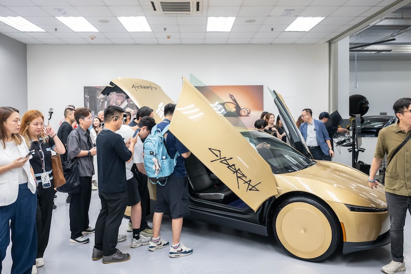Members of the media look at a Tesla Inc. Cybercab driverless car displayed during a preview at the company's delivery center in Hong Kong, China, on Monday, Sept. 7, 2026. The Cybercab, which has been in testing in multiple US cities in recent months, is seen as a key piece of Tesla's plan to evolve beyond a maker of electric vehicles into a pioneer of artificial intelligence products. Photographer: Billy H.C. Kwok/Bloomberg Members of the media look at a Tesla Inc. Cybercab driverless car displayed during a preview at the company's delivery center in Hong Kong, China, on Monday, Sept. 7, 2026. The Cybercab, which has been in testing in multiple US cities in recent months, is seen as a key piece of Tesla's plan to evolve beyond a maker of electric vehicles into a pioneer of artificial intelligence products. Photographer: Billy H.C. Kwok/Bloomberg