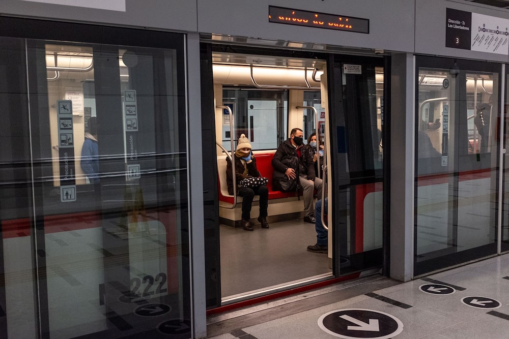 Commuters wear protective masks sit in a subway at a station in Santiago, Chile, on Monday, July 27, 2020. President Sebastian Pinera signed a bill into law late Friday allowing Chileans to withdraw retirement savings, following scenes of citizens lining up by the thousands outside pension fund offices. Photographer: Cristobal Olivares/Bloomberg Commuters wear protective masks sit in a subway at a station in Santiago, Chile, on Monday, July 27, 2020. President Sebastian Pinera signed a bill into law late Friday allowing Chileans to withdraw retirement savings, following scenes of citizens lining up by the thousands outside pension fund offices. Photographer: Cristobal Olivares/Bloomberg