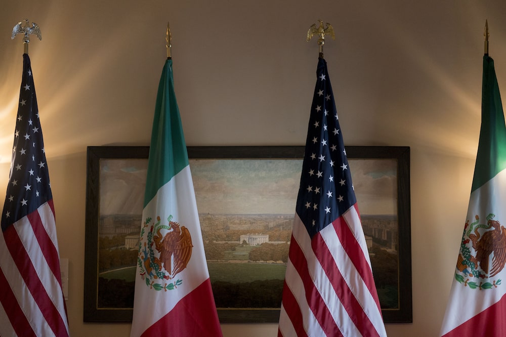 American and Mexican flags stand in front of a paining of the White House at the U.S. Treasury in Washington, D.C, U.S., on Wednesday, Oct. 17, 2018. The Treasury plans to triple the size of an emergency swap line for Mexico to $9 billion, giving the Latin American nation more of a financial cushion as emerging markets come under pressure from rising U.S. interest rates. Photographer: Andrew Harrer/Bloomberg American and Mexican flags stand in front of a paining of the White House at the U.S. Treasury in Washington, D.C, U.S., on Wednesday, Oct. 17, 2018. The Treasury plans to triple the size of an emergency swap line for Mexico to $9 billion, giving the Latin American nation more of a financial cushion as emerging markets come under pressure from rising U.S. interest rates. Photographer: Andrew Harrer/Bloomberg