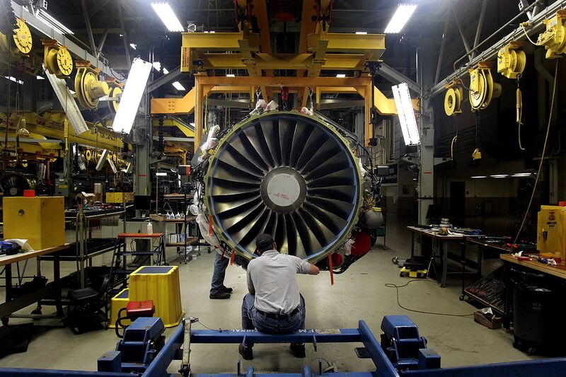 Technicians work on a General Electric Co. CFM56-5 jet engine at the company's Aviation Assembly & Test plant in Durham, North Carolina, U.S., on Monday, Oct. 8, 2007. General Electric Co., the world's second-biggest company by market value, said profit rose 7.1 percent in the third quarter on overseas sales of locomotives, airplane engines and turbines for power-generation plants. Photographer: Jim R. Bounds/Bloomberg News Technicians work on a General Electric Co. CFM56-5 jet engine at the company's Aviation Assembly & Test plant in Durham, North Carolina, U.S., on Monday, Oct. 8, 2007. General Electric Co., the world's second-biggest company by market value, said profit rose 7.1 percent in the third quarter on overseas sales of locomotives, airplane engines and turbines for power-generation plants. Photographer: Jim R. Bounds/Bloomberg News