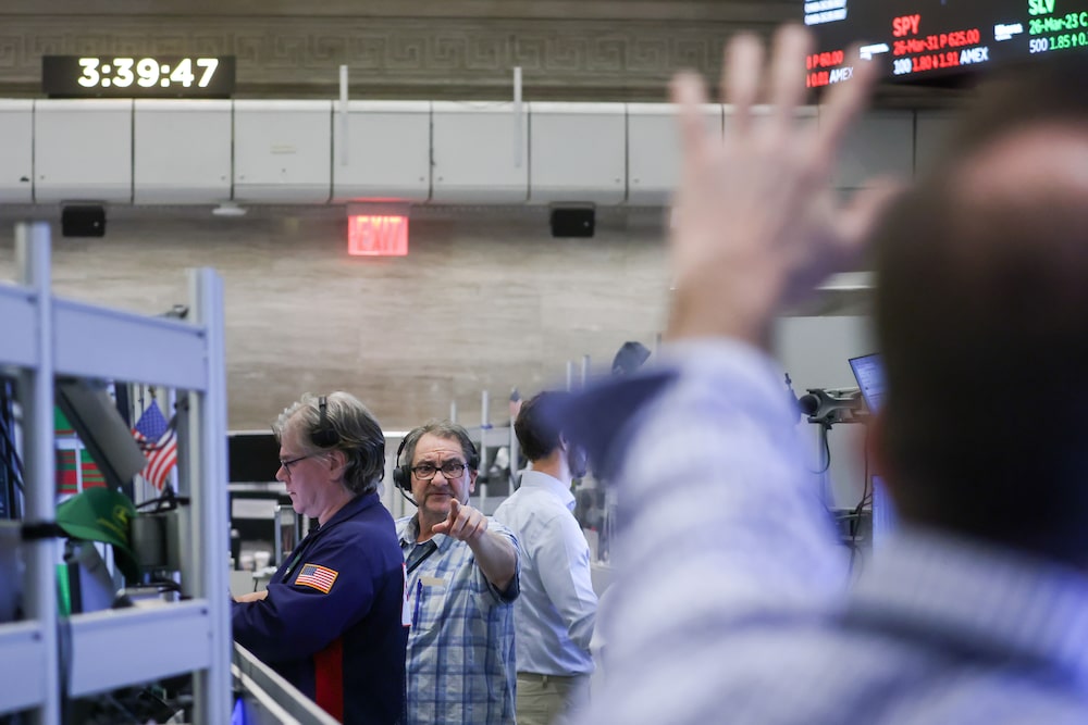 Traders work on the floor of the American Stock Exchange (AMEX) at the New York Stock Exchange (NYSE) in New York, US, on Monday, March 23, 2026. US stocks rallied on Monday after President Donald Trump ordered the Pentagon to hold off on military strikes against Iranian energy infrastructure, spurring a retreat in oil prices. Photographer: Michael Nagle/Bloomberg Traders work on the floor of the American Stock Exchange (AMEX) at the New York Stock Exchange (NYSE) in New York, US, on Monday, March 23, 2026. US stocks rallied on Monday after President Donald Trump ordered the Pentagon to hold off on military strikes against Iranian energy infrastructure, spurring a retreat in oil prices. Photographer: Michael Nagle/Bloomberg