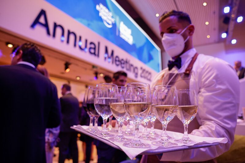 A waiter serves wine during the Welcome Reception ahead of the World Economic Forum (WEF) in Davos, Switzerland. A waiter serves wine during the Welcome Reception ahead of the World Economic Forum (WEF) in Davos, Switzerland.