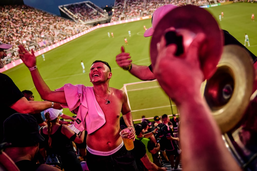 (EDITOR'S NOTE: ONE TIME US,E ONLY IN CONNECTION WITH "Messi Fuels a Wealth Boom in US, Soccer That Risks Unraveling Once He’s Gone" by Michael Smith and Guillermo Molero.) Members of Vice City 1896, Inter Miami's fan led band and supporter group, cheer and play their instruments during the match against the Chicago Fire at Chase Stadium in Fort Lauderdale, Florida, US, on Saturday, July 20, 2024. MLS team values have surged $3.2 billion since the Argentine football star, Lionel Messi, arrived in Miami. Photographer: Scott McIntyre/Bloomberg (EDITOR'S NOTE: ONE TIME US,E ONLY IN CONNECTION WITH "Messi Fuels a Wealth Boom in US, Soccer That Risks Unraveling Once He’s Gone" by Michael Smith and Guillermo Molero.) Members of Vice City 1896, Inter Miami's fan led band and supporter group, cheer and play their instruments during the match against the Chicago Fire at Chase Stadium in Fort Lauderdale, Florida, US, on Saturday, July 20, 2024. MLS team values have surged $3.2 billion since the Argentine football star, Lionel Messi, arrived in Miami. Photographer: Scott McIntyre/Bloomberg