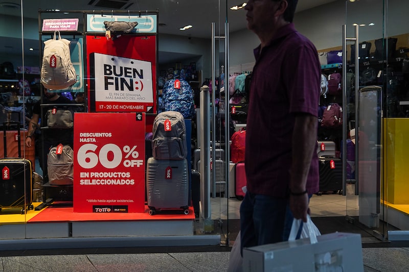 A shopper walks past a luggage store at the Parque Delta mall during Buen Fin in Mexico City, Mexico, on Friday, Nov. 17, 2023. Mexico's annual inflation slowed in line with expectations in October, giving the central bank some maneuvering room as it prepares for one of its last interest rate decisions of the year. Photographer: Marian Carrasquero/Bloomberg A shopper walks past a luggage store at the Parque Delta mall during Buen Fin in Mexico City, Mexico, on Friday, Nov. 17, 2023. Mexico's annual inflation slowed in line with expectations in October, giving the central bank some maneuvering room as it prepares for one of its last interest rate decisions of the year. Photographer: Marian Carrasquero/Bloomberg