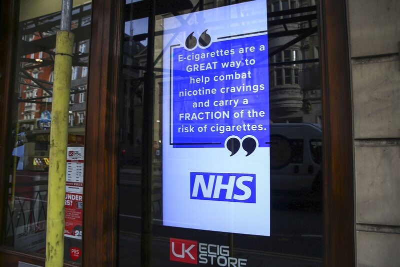 An advisory for e-cigarettes from the state-run National Health Service (MHS) sits in the window of an e-cigarette store in London, U.K., on Wednesday, Oct. 9, 2019. An advisory for e-cigarettes from the state-run National Health Service (MHS) sits in the window of an e-cigarette store in London, U.K., on Wednesday, Oct. 9, 2019.