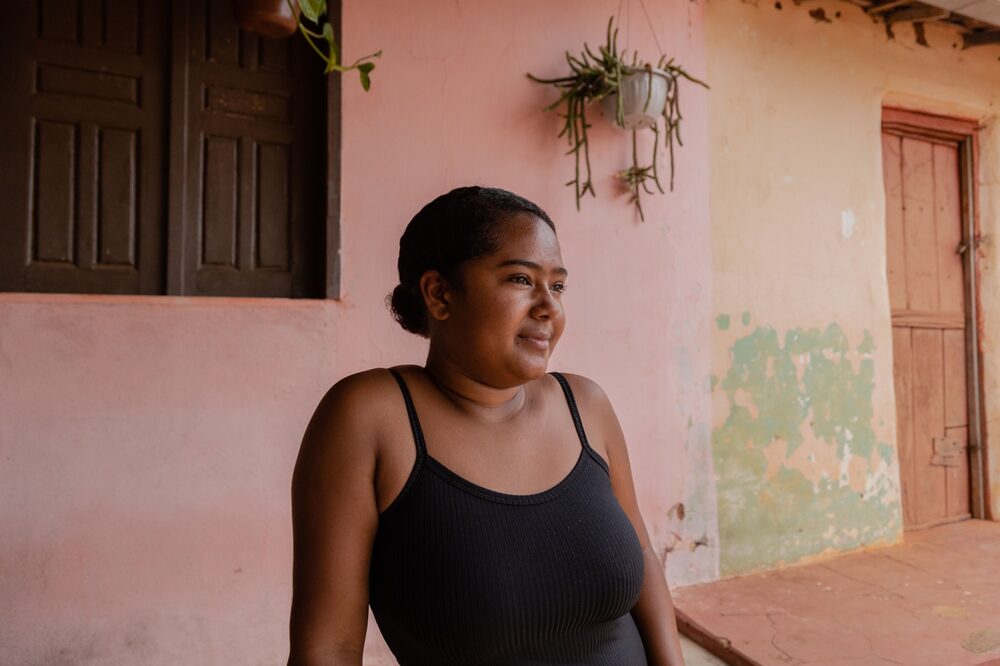 Tamara Leite de Souza, 20, in front of her family's restaurant. Tamara Leite de Souza, 20, in front of her family's restaurant.