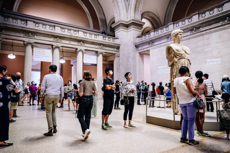 Visitors wearing protective masks wait in line during the public reopening at the Metropolitan Museum of Art in New York, U.S., on Saturday, Aug. 29, 2020. After more than five months in hibernation, the museums of New York are slowly starting to reopen, reawakening part of the cultural life of the city. Photographer: Nina Westervelt/Bloomberg Visitors wearing protective masks wait in line during the public reopening at the Metropolitan Museum of Art in New York, U.S., on Saturday, Aug. 29, 2020. After more than five months in hibernation, the museums of New York are slowly starting to reopen, reawakening part of the cultural life of the city. Photographer: Nina Westervelt/Bloomberg