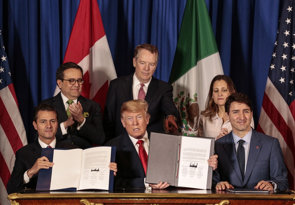 Enrique Pena Nieto, Mexico's president, from front left, U.S. president Donald Trump, and Justin Trudeau, Canada's prime minister, sit for photographs as Ildefonso Guajardo Villarreal, Mexico's secretary of economy, from back left, Robert Lighthizer, U.S. trade representative, and Chrystia Freeland, Canada's minister of foreign affairs, stand after signing the United States-Mexico-Canada Agreement (USMCA) at the G-20 Leaders' Summit in Buenos Aires, Argentina, on Friday Nov. 30, 2018. The U.S., Canada and Mexico are set to sign their new trade deal Friday following a year of intense negotiations to revamp the continent's free trade zone - after President Trump threats to kill it. Photographer: Sarah Pabst/Bloomberg Enrique Pena Nieto, Mexico's president, from front left, U.S. president Donald Trump, and Justin Trudeau, Canada's prime minister, sit for photographs as Ildefonso Guajardo Villarreal, Mexico's secretary of economy, from back left, Robert Lighthizer, U.S. trade representative, and Chrystia Freeland, Canada's minister of foreign affairs, stand after signing the United States-Mexico-Canada Agreement (USMCA) at the G-20 Leaders' Summit in Buenos Aires, Argentina, on Friday Nov. 30, 2018. The U.S., Canada and Mexico are set to sign their new trade deal Friday following a year of intense negotiations to revamp the continent's free trade zone - after President Trump threats to kill it. Photographer: Sarah Pabst/Bloomberg