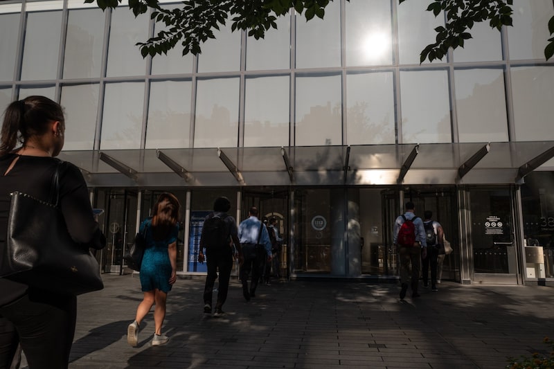 Workers enter Citigroup headquarters in New York. Workers enter Citigroup headquarters in New York.