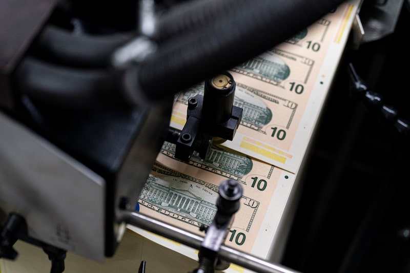 Stacks of 10 dollar banknotes. Stacks of 10 dollar banknotes.