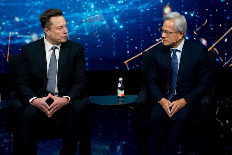Elon Musk y Jensen Huang. Elon Musk y Jensen Huang.