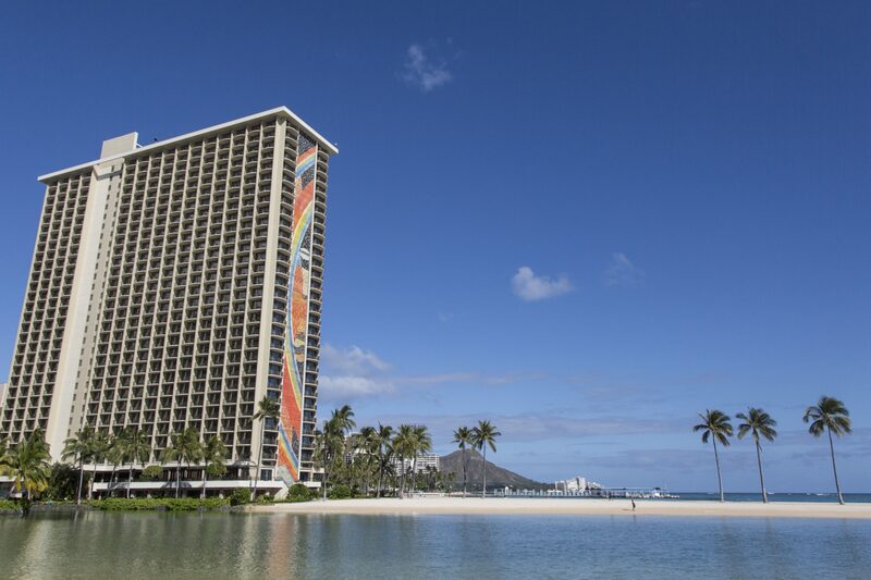 The Hilton Hawaiian Village Wakiki Beach resort stands next to the Duke Kahanamoku Lagoon in Honolulu, Hawaii, U.S., on Monday, May 11, 2020. Hawaii reports no new virus cases for the first time in nearly two months, the Associated Press reported. Photographer: Marie Eriel Hobro/Bloomberg The Hilton Hawaiian Village Wakiki Beach resort stands next to the Duke Kahanamoku Lagoon in Honolulu, Hawaii, U.S., on Monday, May 11, 2020. Hawaii reports no new virus cases for the first time in nearly two months, the Associated Press reported. Photographer: Marie Eriel Hobro/Bloomberg