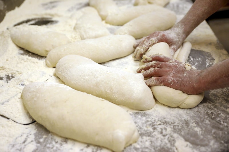 A baker kneads dough by hand while making bread at a bakery in Rome, Italy, on Wednesday, March 9, 2022. Wheat futures swung wildly between gains and losses Tuesday after climbing to unprecedented heights as Russia's attack on Ukraine disrupts global food supplies. Photographer: Alessia Pierdomenico/Bloomberg A baker kneads dough by hand while making bread at a bakery in Rome, Italy, on Wednesday, March 9, 2022. Wheat futures swung wildly between gains and losses Tuesday after climbing to unprecedented heights as Russia's attack on Ukraine disrupts global food supplies. Photographer: Alessia Pierdomenico/Bloomberg