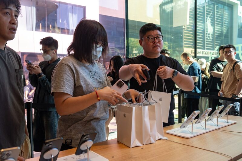 Customers at an Apple Inc. store during the first day of sale of the iPhone 15 smartphone in Beijing, China, on Friday, Sept. 22, 2023. Apple's latest iPhones and watches went on sale today, a test of whether a new smartphone design and modest smartwatch changes can help return the company to growth. Customers at an Apple Inc. store during the first day of sale of the iPhone 15 smartphone in Beijing, China, on Friday, Sept. 22, 2023. Apple's latest iPhones and watches went on sale today, a test of whether a new smartphone design and modest smartwatch changes can help return the company to growth.