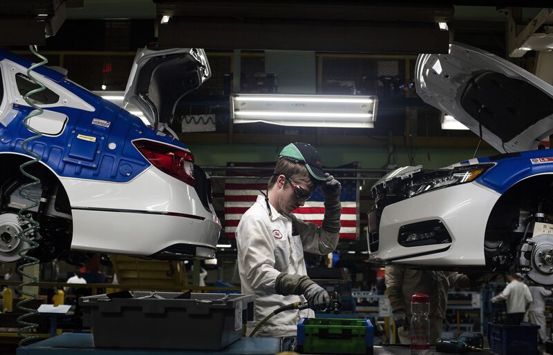 A production associate adjusts his hat while working between 2018 Honda Accord vehicles during production at the Honda of America Manufacturing Inc. Marysville Auto Plant in Marysville, Ohio, U.S.Photographer: Ty Wright/Bloomberg A production associate adjusts his hat while working between 2018 Honda Accord vehicles during production at the Honda of America Manufacturing Inc. Marysville Auto Plant in Marysville, Ohio, U.S.Photographer: Ty Wright/Bloomberg