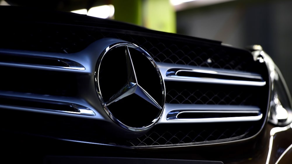 BREMEN, GERMANY - JANUARY 24: The emblem of a Mercedes-Benz of C-Class car is pictured on the assembly line of Mercedes-Benz on January 24, 2017 in Bremen, Germany. Daimler AG, which owns Mercedes, is scheduled to present its financial results for 2016 on February 2. Many German automakers are concerned over recent comments by U.S. President Donald Trump over possible tariffs on cars produced outside of the USA. (Photo by Alexander Koerner/Getty Images) BREMEN, GERMANY - JANUARY 24: The emblem of a Mercedes-Benz of C-Class car is pictured on the assembly line of Mercedes-Benz on January 24, 2017 in Bremen, Germany. Daimler AG, which owns Mercedes, is scheduled to present its financial results for 2016 on February 2. Many German automakers are concerned over recent comments by U.S. President Donald Trump over possible tariffs on cars produced outside of the USA. (Photo by Alexander Koerner/Getty Images)