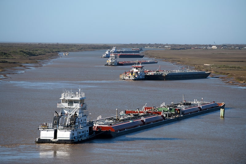Barges sit in the intracoastal waterway in Freeport, Texas, US Barges sit in the intracoastal waterway in Freeport, Texas, US