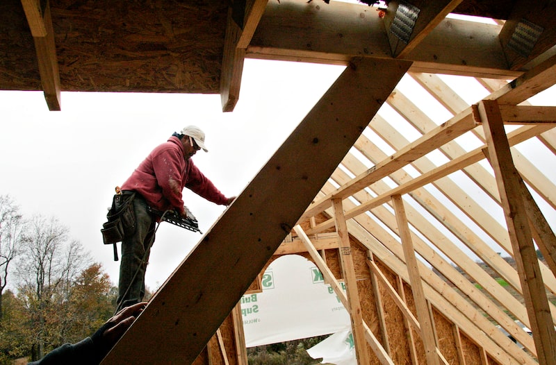 A carpenter uses a nail gun as he stands on the roof of a home under construction in Garner, North Carolina, U.S., on Wednesday, Nov. 18, 2009. Residential construction in the U.S. unexpectedly dropped in October amid concern a homebuyer tax credit would expire, illustrating the market’s dependence on government help to sustain a recovery as job losses mount. Photographer: Jim R. Bounds/Bloomberg A carpenter uses a nail gun as he stands on the roof of a home under construction in Garner, North Carolina, U.S., on Wednesday, Nov. 18, 2009. Residential construction in the U.S. unexpectedly dropped in October amid concern a homebuyer tax credit would expire, illustrating the market’s dependence on government help to sustain a recovery as job losses mount. Photographer: Jim R. Bounds/Bloomberg