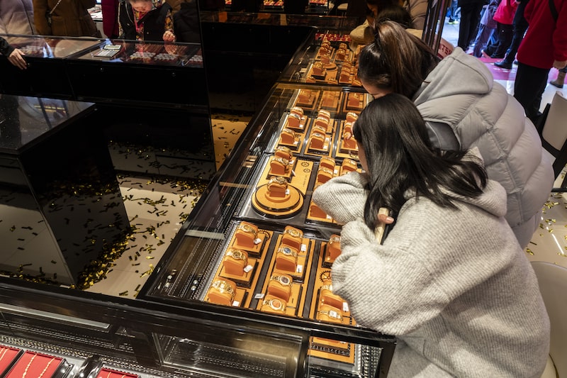 Shoppers look at gold products at a gold store in Shanghai, China, on Thursday, Feb. 19, 2026. Feb. 17 marked the start of the Year of the Fire Horse, a period in the lunar calendar defined by bold energy and decisive action, according to the Chinese zodiac. Photographer: Qilai Shen/Bloomberg Shoppers look at gold products at a gold store in Shanghai, China, on Thursday, Feb. 19, 2026. Feb. 17 marked the start of the Year of the Fire Horse, a period in the lunar calendar defined by bold energy and decisive action, according to the Chinese zodiac. Photographer: Qilai Shen/Bloomberg
